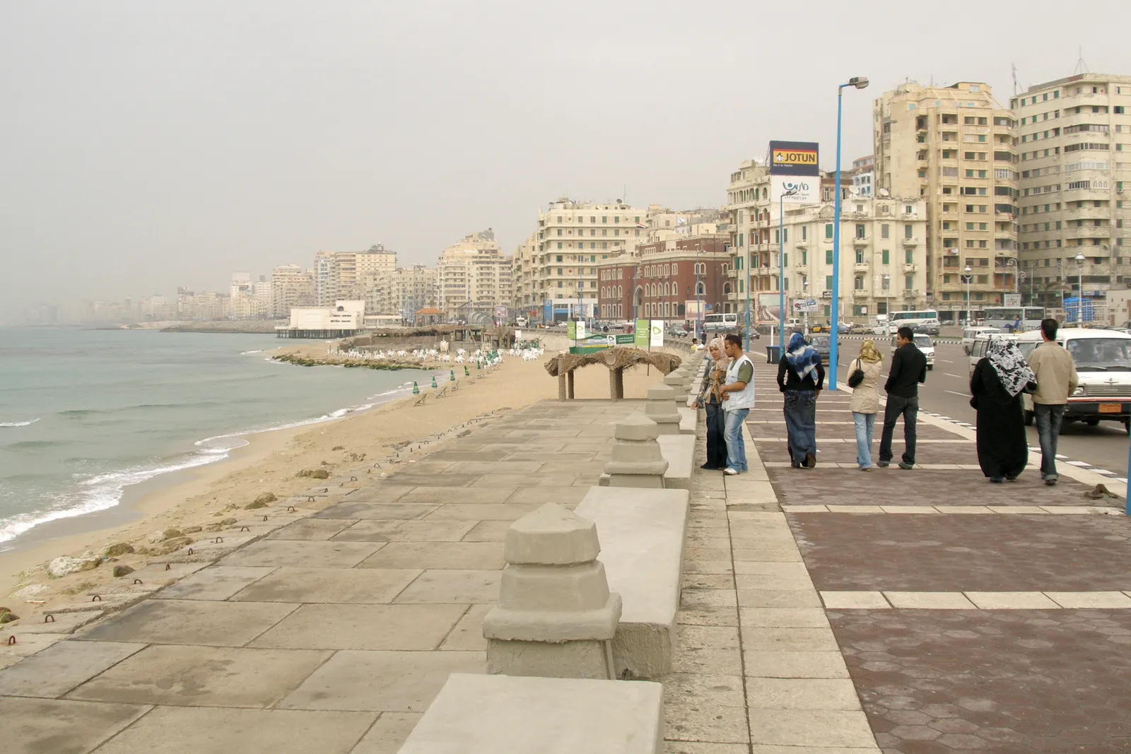 Elevated view of Alexandria's Eastern Harbour packed with fishing boats, with the Citadel of Qaitbay standing at the water's edge.